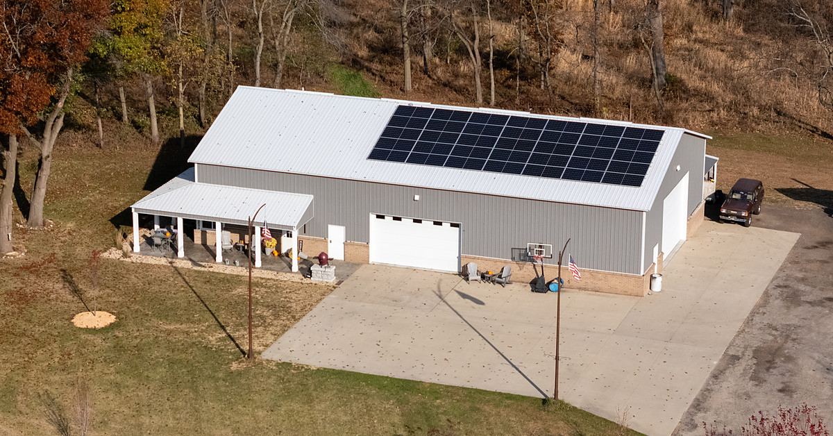 Solar array on a pole barn roof in autumn