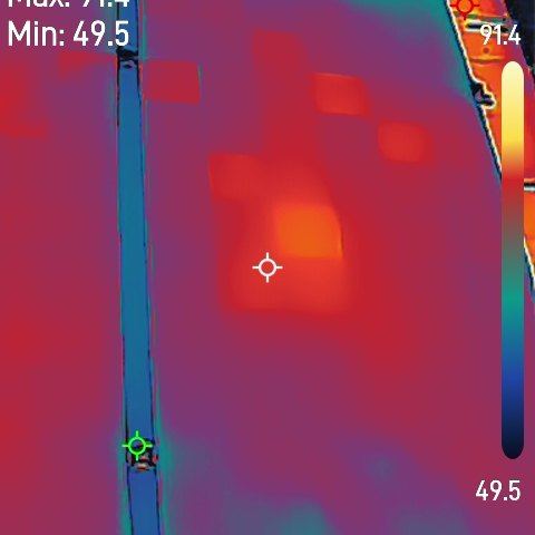 Thermal image of a solar module showing a soft, diffuse warm patch