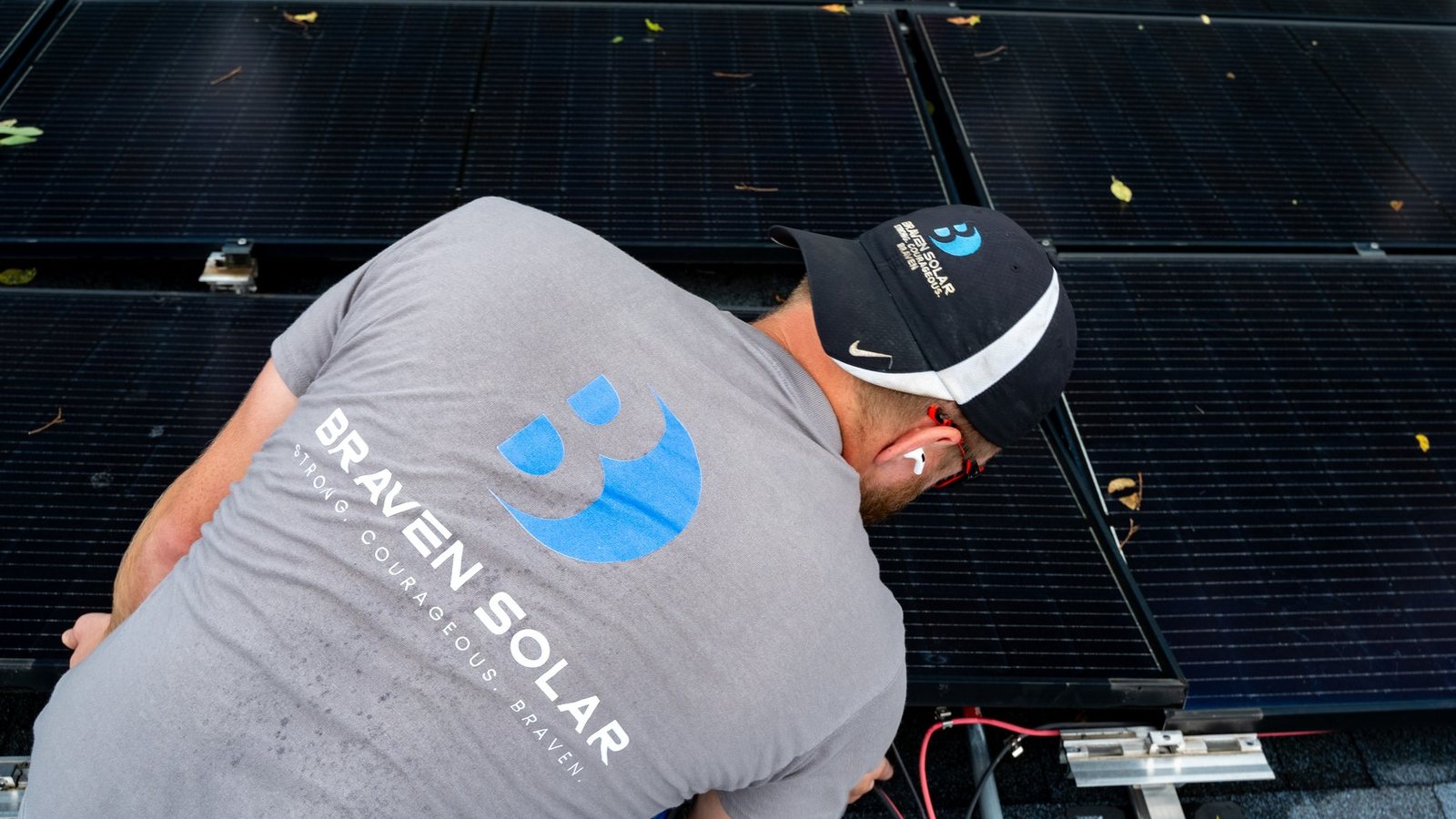 Braven Solar technician working on a residential rooftop solar array