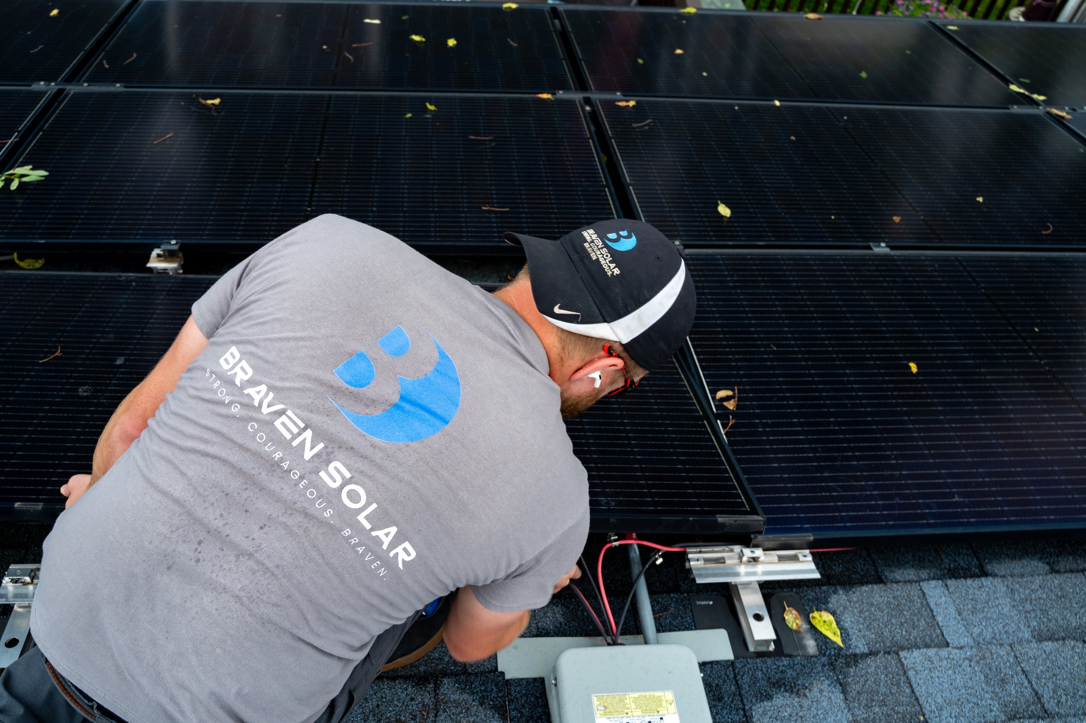 Braven Solar technician working on rooftop solar
