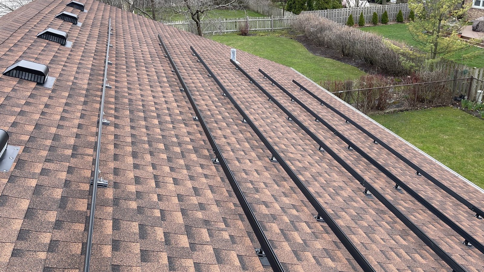 Rooftop solar racking rails during installation or detach and reset work